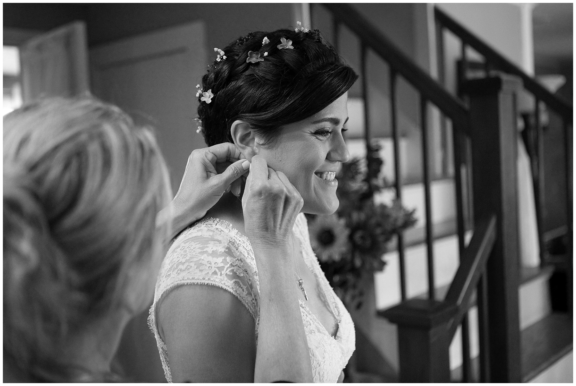 photo of bride having family member help wiht her earrings