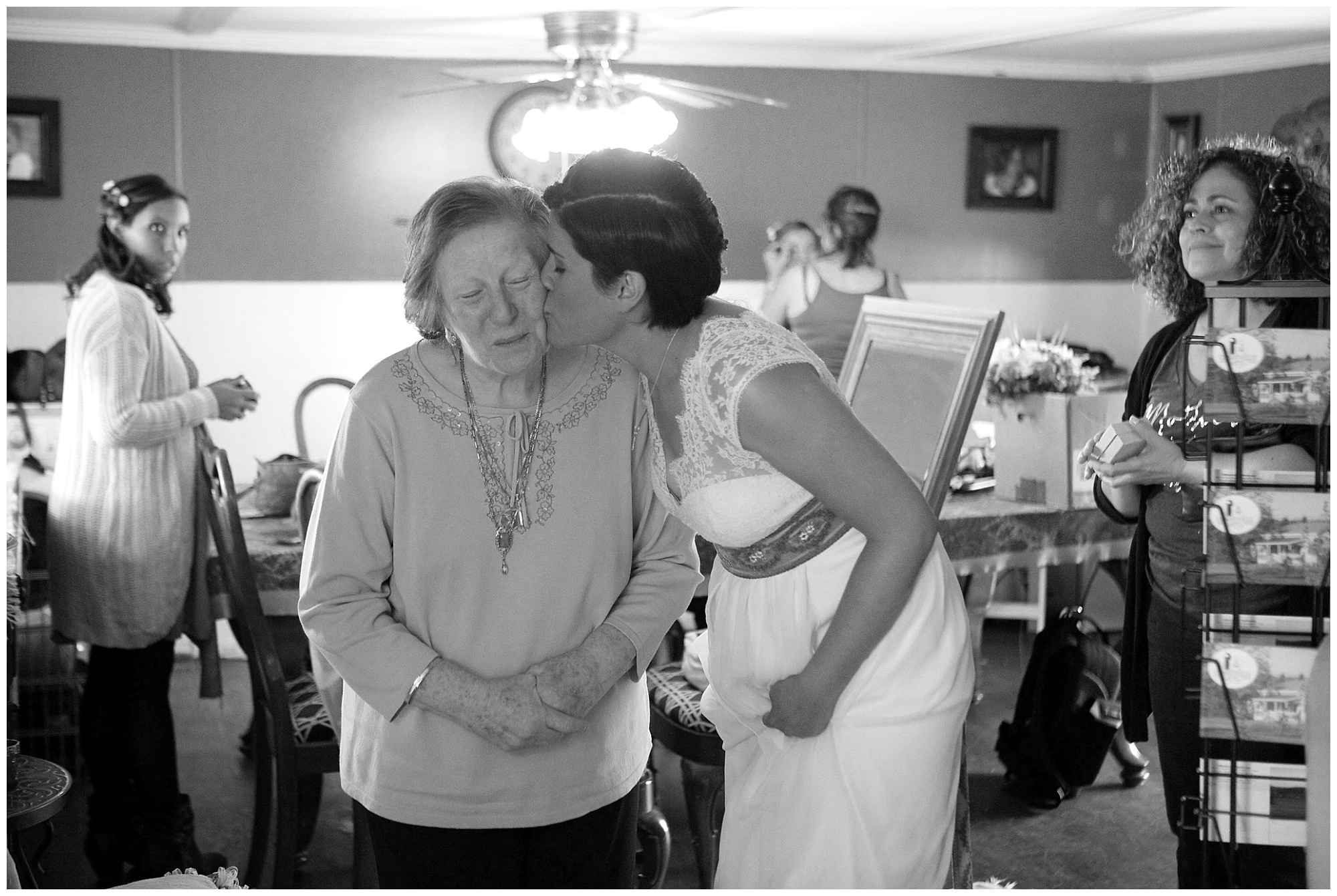 shoto of bride kissing her grandmother on the cheek