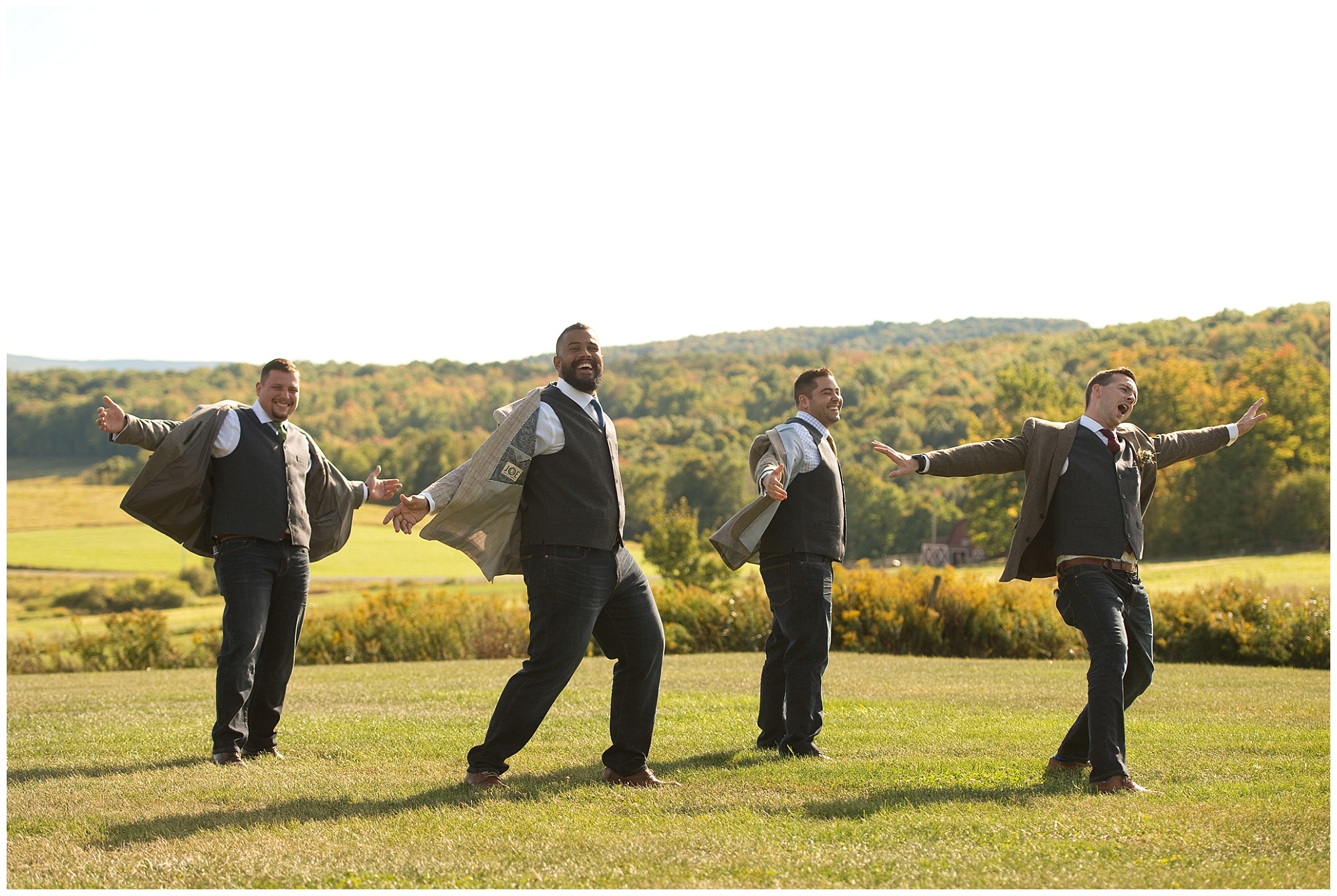 The groom and groomsmen being playful for this photo. 