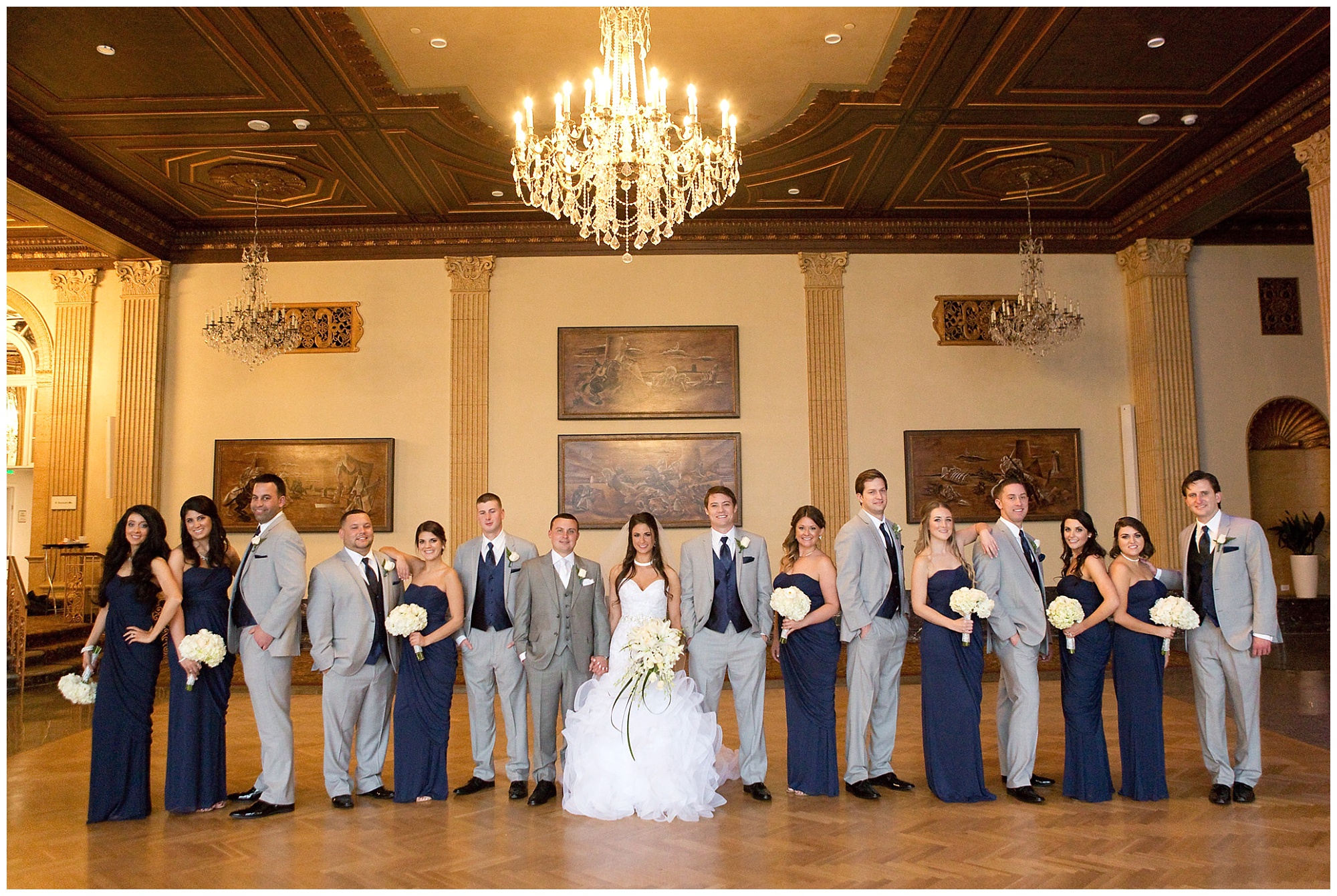 Photo of the wedding party in a editorial styled group portrait.