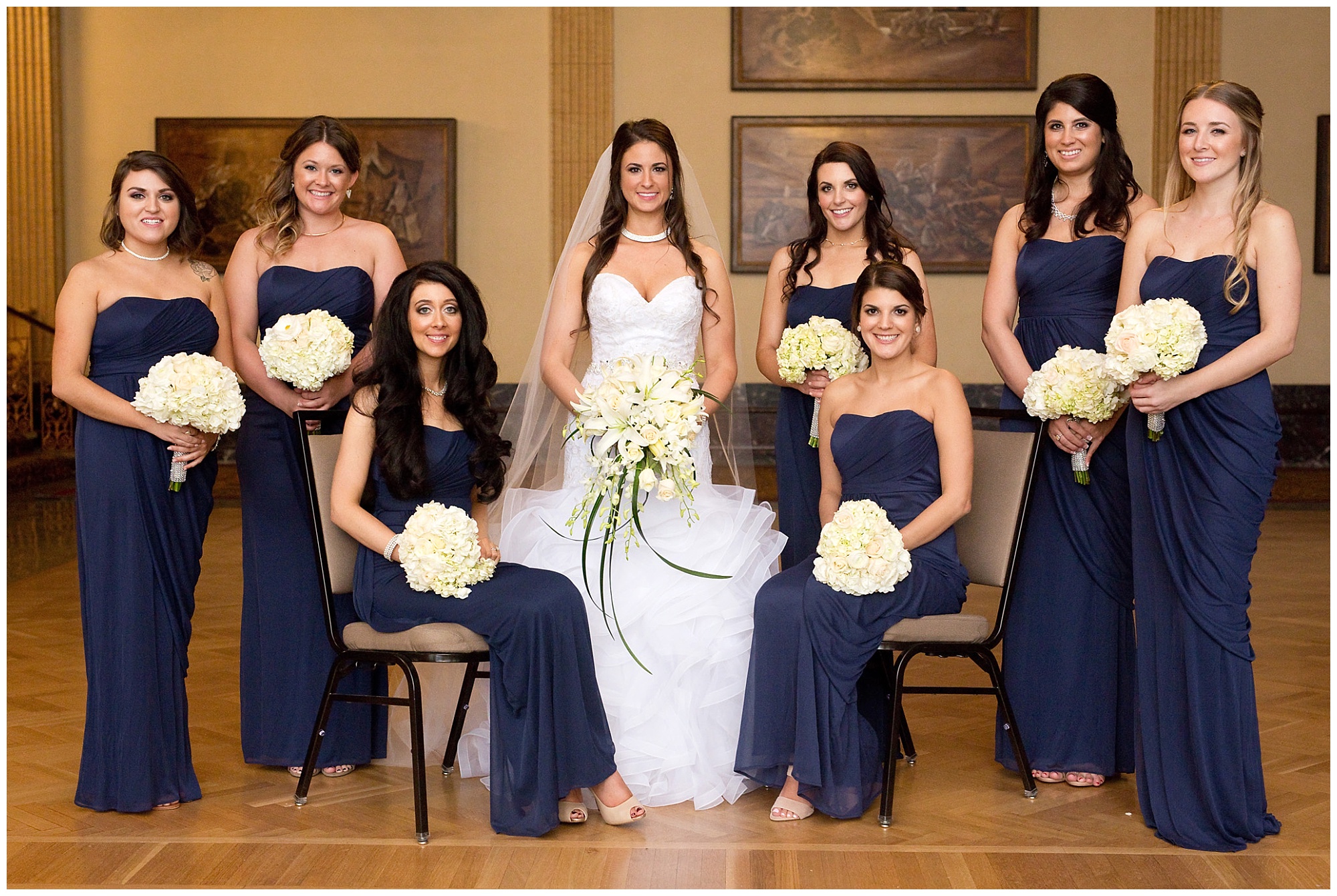 Photo of the bride and her ladies in a group portrait.