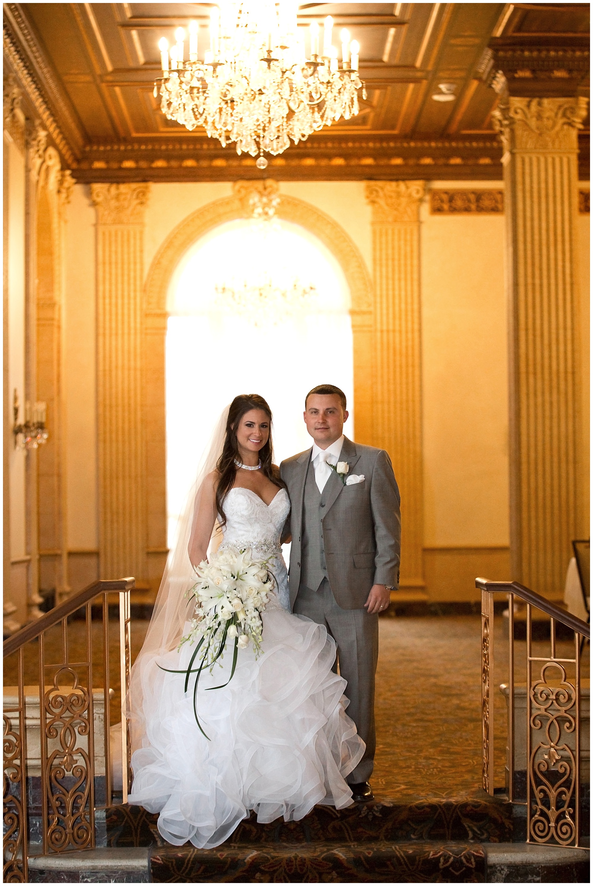 Photo portrait of the bride and groom standing side by side.