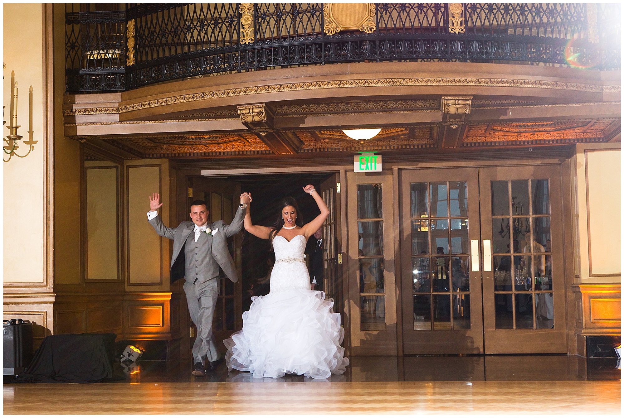 Photo of a bride and groom making their grand entrance to their reception.