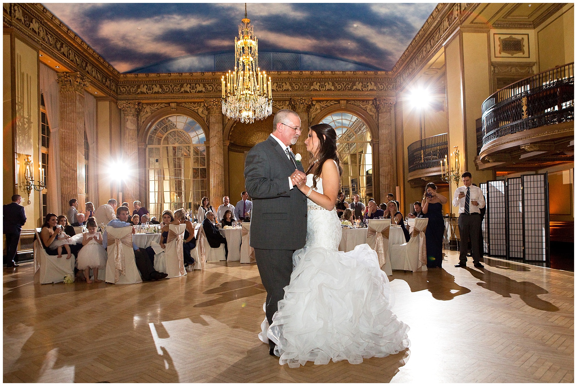 Photos of the bride and her father during the parent dances of the wedding reception.