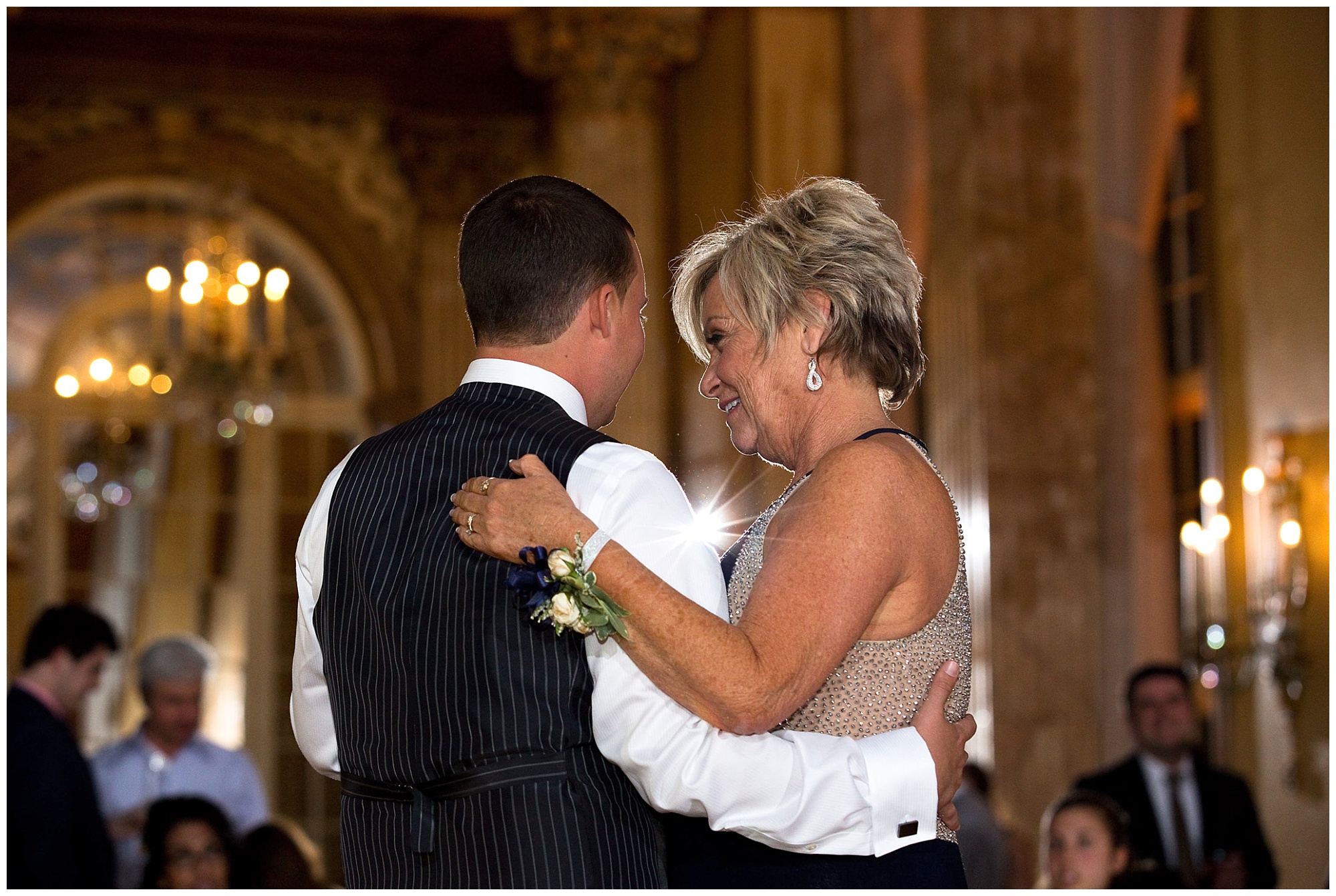 Photos of the groom and his mother during the parent dances of the wedding reception.
