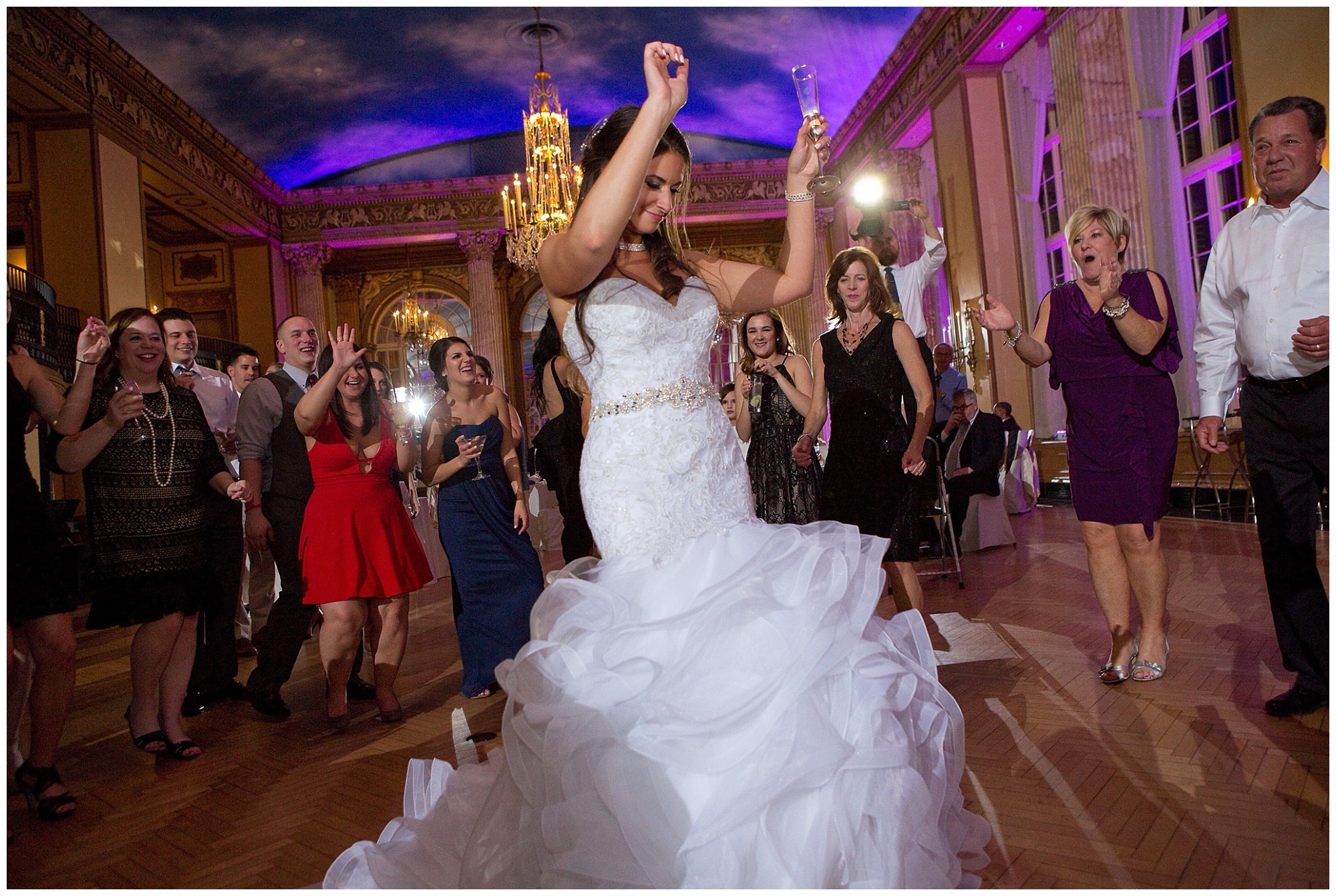 Photos of the bride on the dance floor with a glass of champagne in her hand.