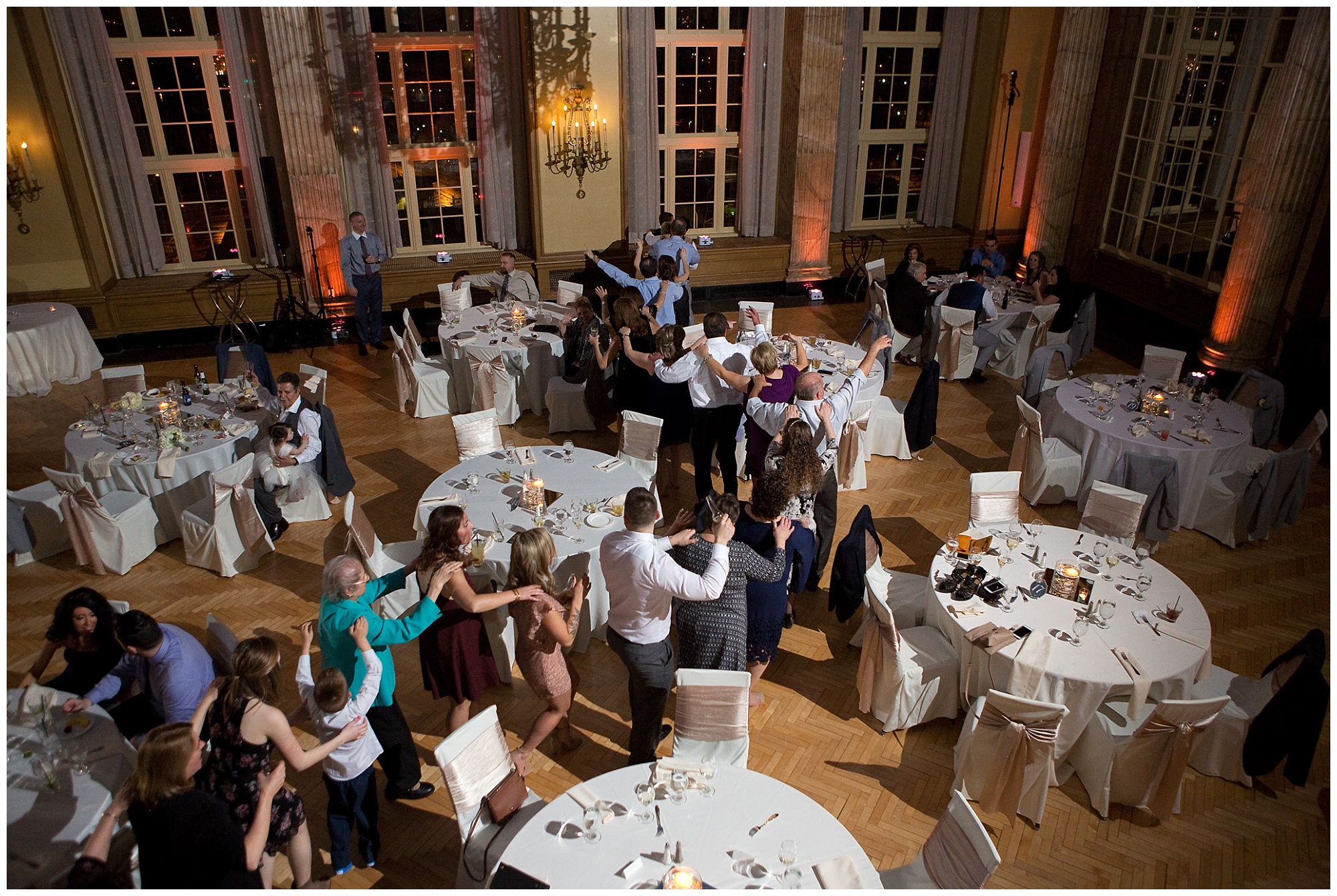 Photo of a conga line short from above in the recption balcony.