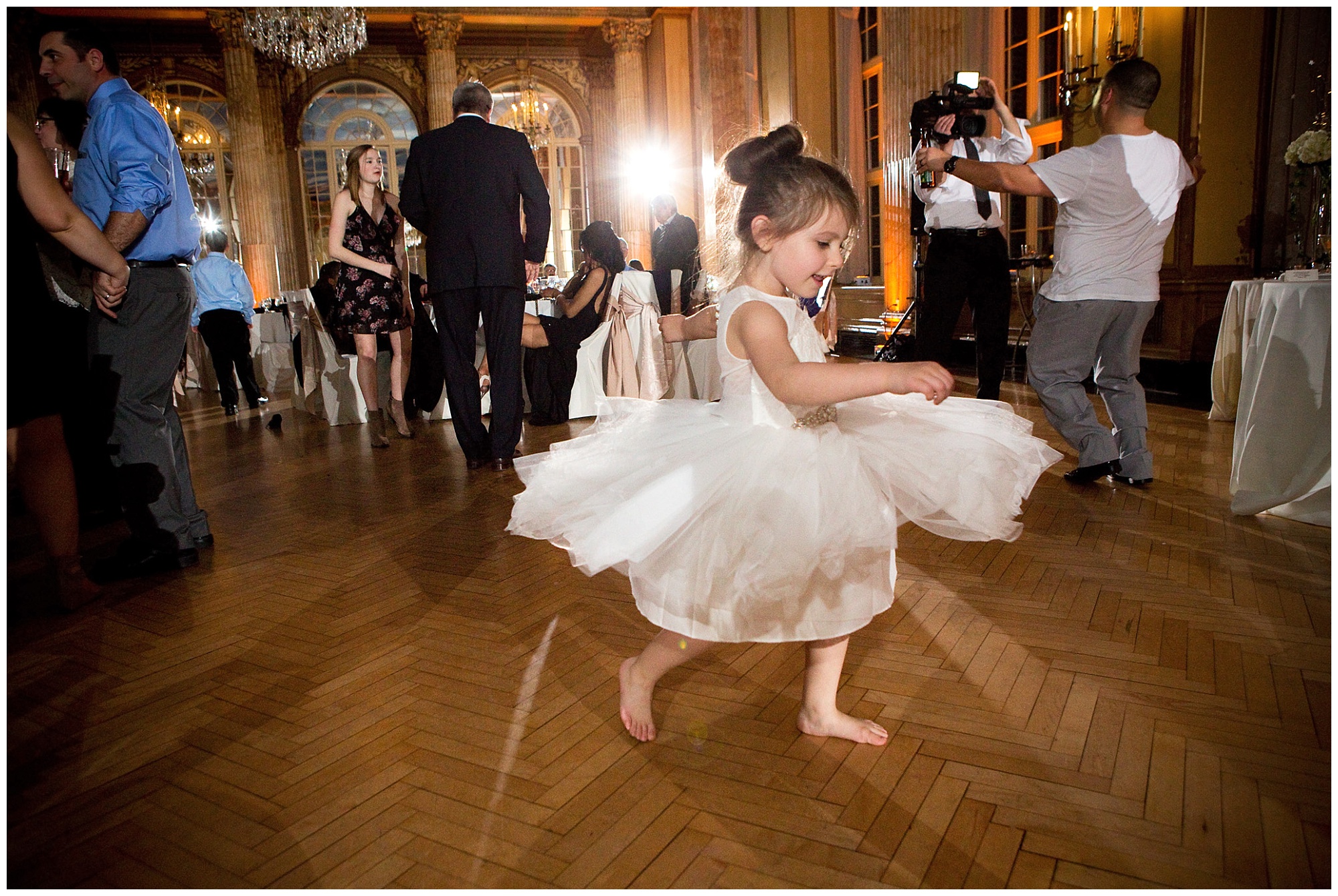 Photo of the flower girl spinning on the dance floor