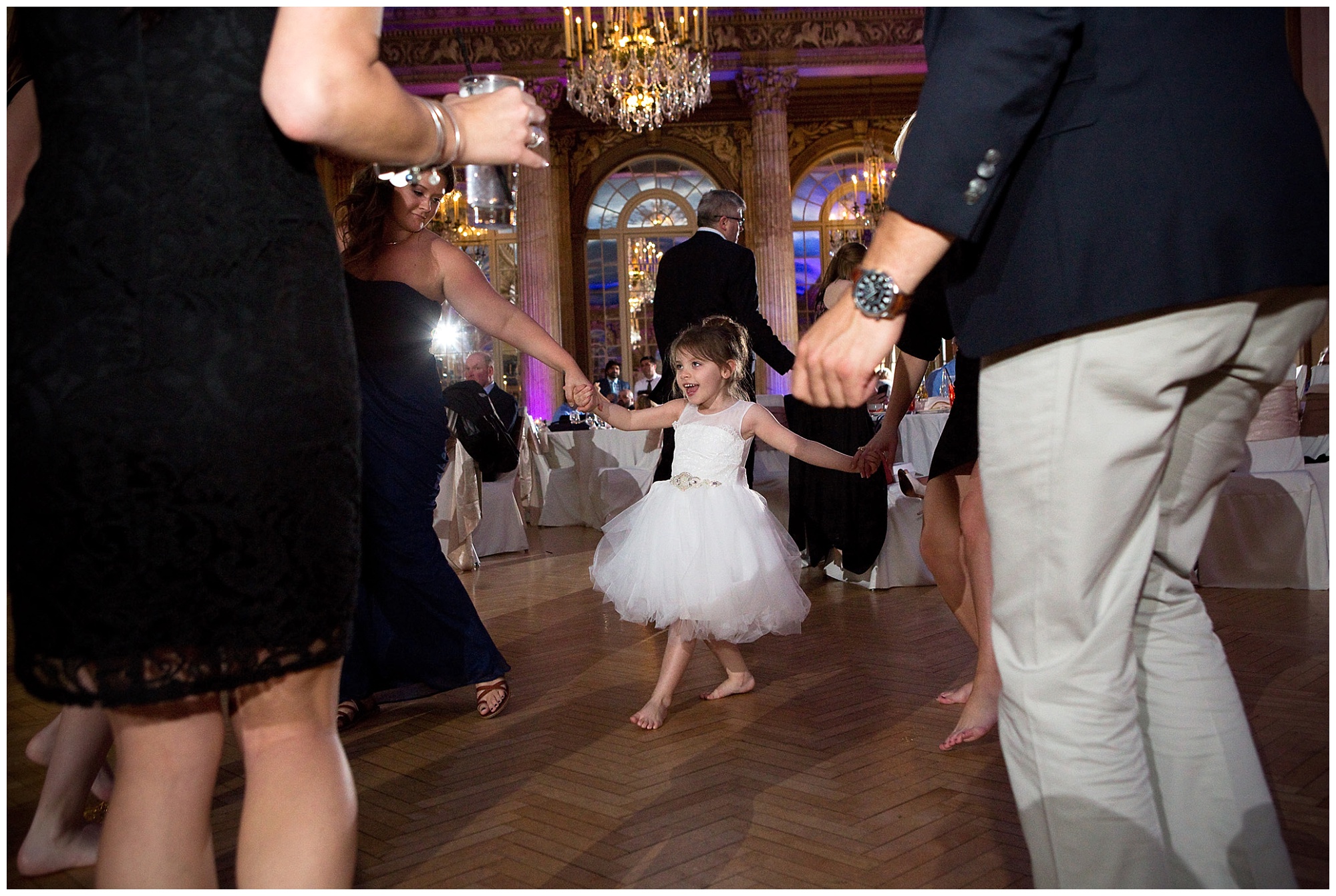 Photo of guests dancing hand ing hand