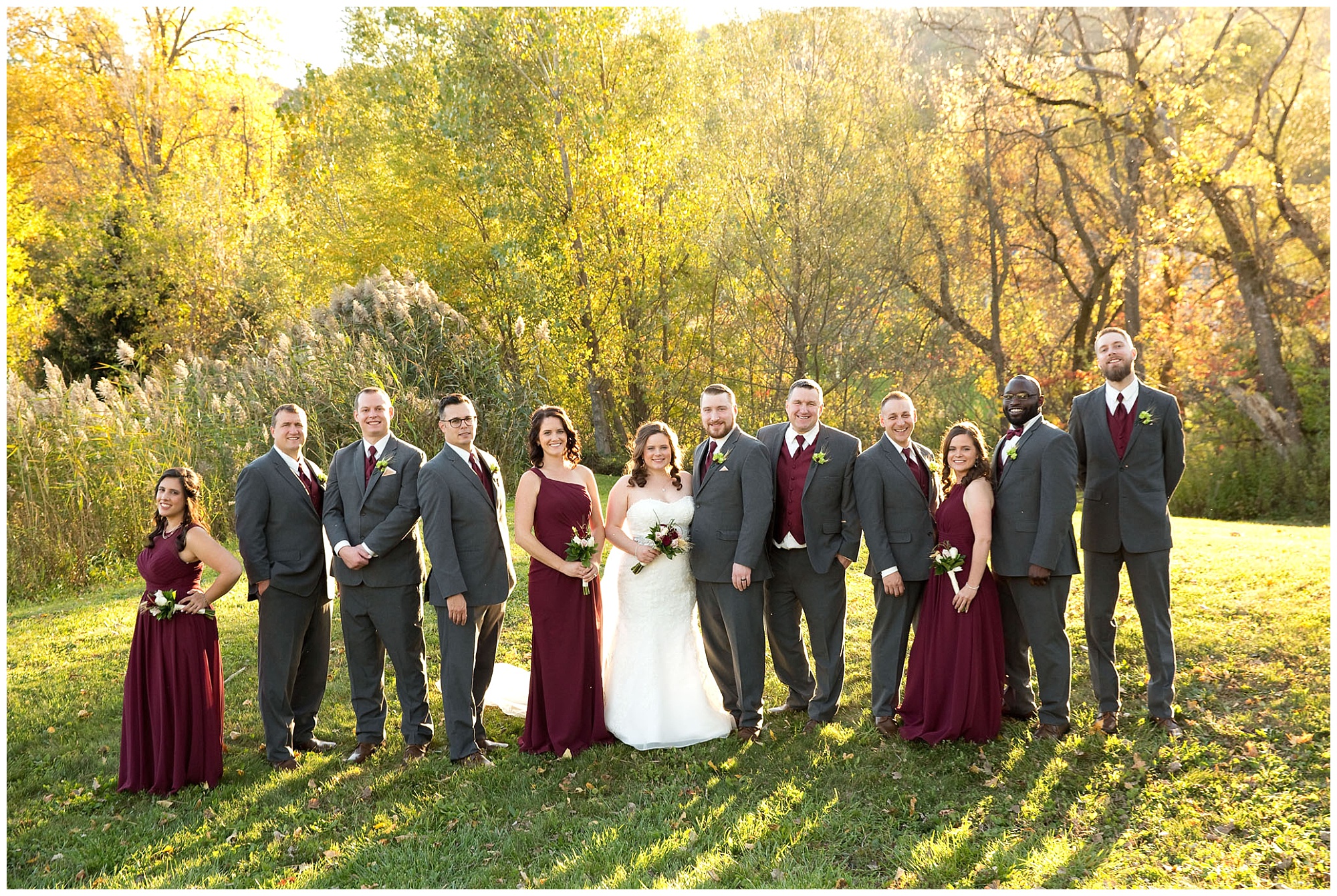 A wedding party photo backlighted by the alte autumn afternoon sun.