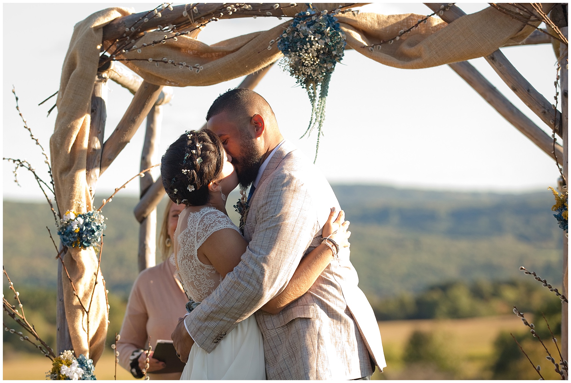 photo of the bride and grooms first kiss.