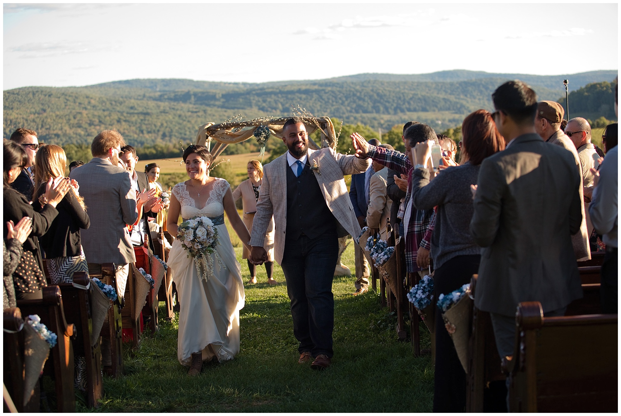 bride and groom joyfully exiting the recessional.