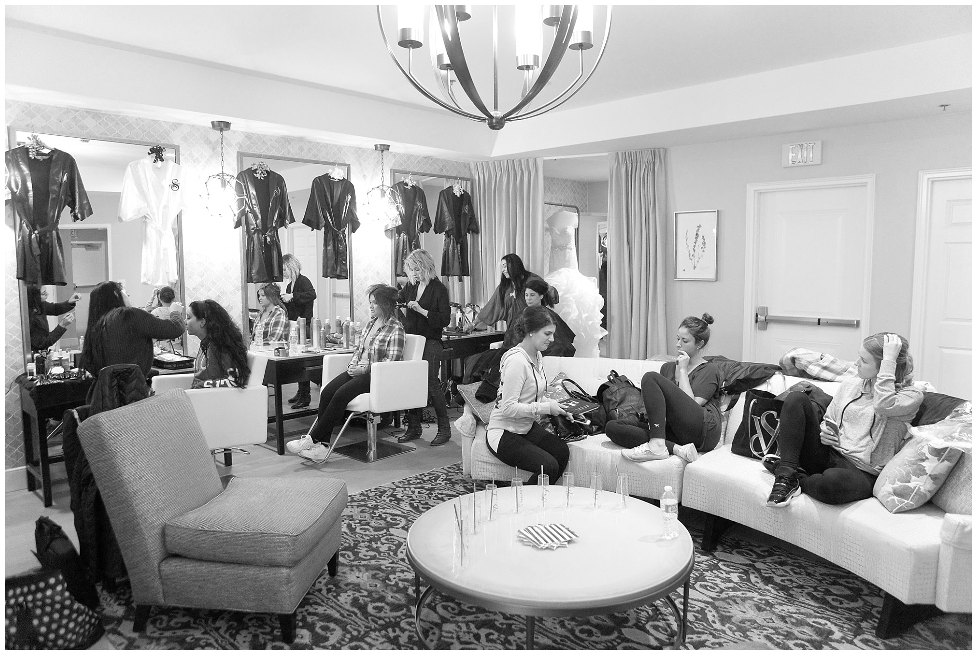 Photo of a bridal suite filled with a bridal part getting ready.