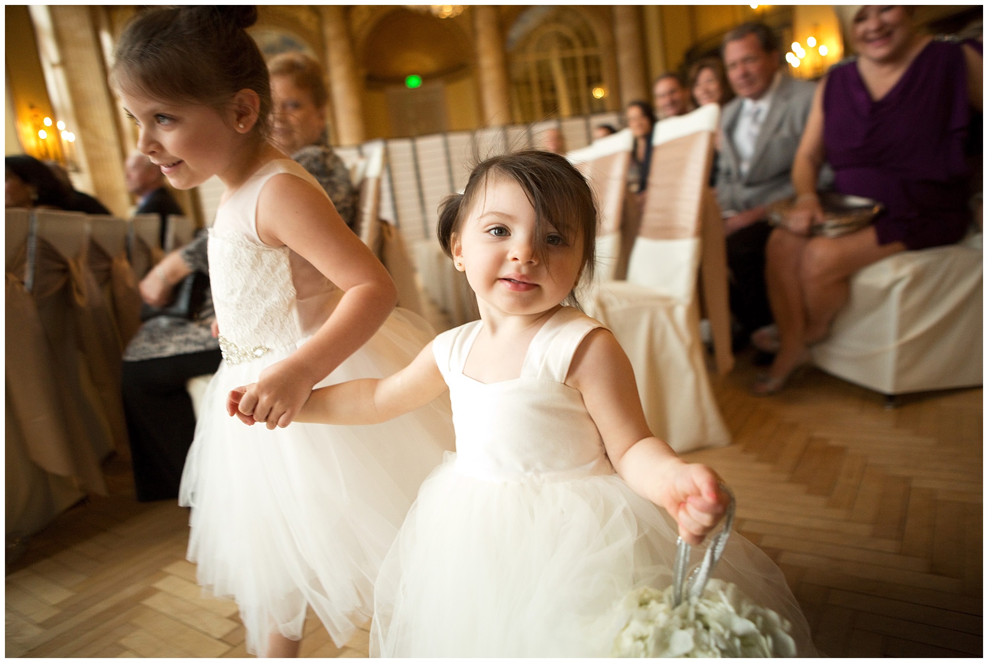 Adorable photo of a flower girl during a wedding procession.